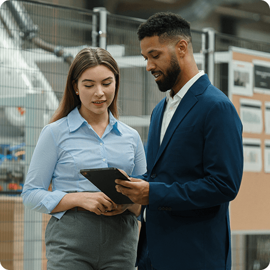 Two people looking at a tablet