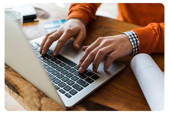 Person typing on laptop