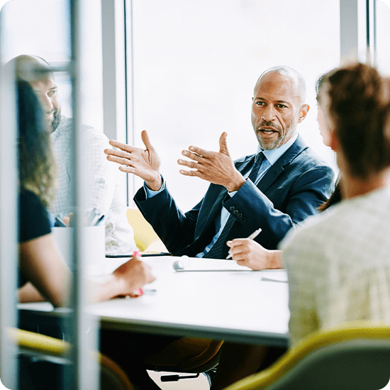 Group of people talking in a boardroom