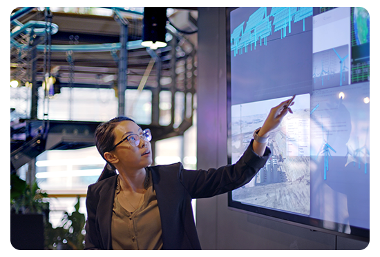 Woman pointing at a projected screen