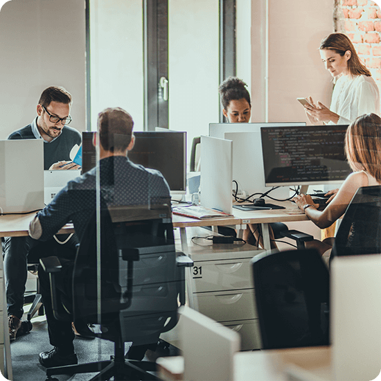 A group of employees in an office working