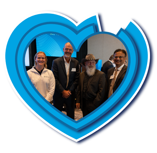 People standing inside of a blue heart