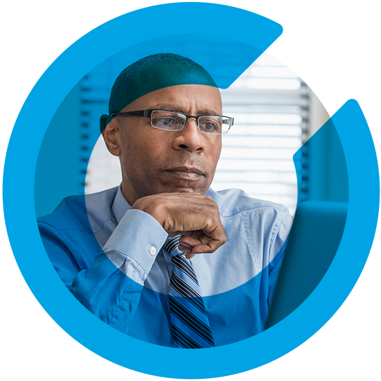 A man in an office, with a blue C overlay