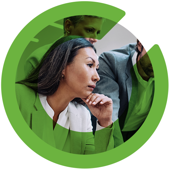 A woman looking over a screen, with a green C overlay