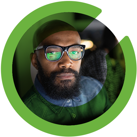 A profile of a man with a green C overlay