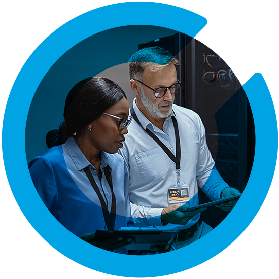 Two people looking over a tablet, with a blue C overlay