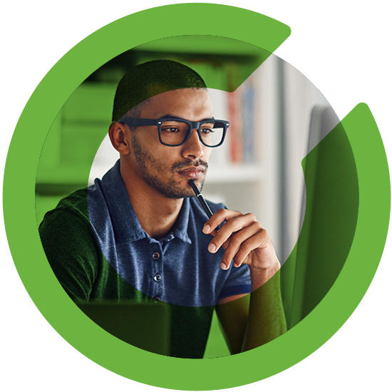 A man looking over a screen, with a green C overlay