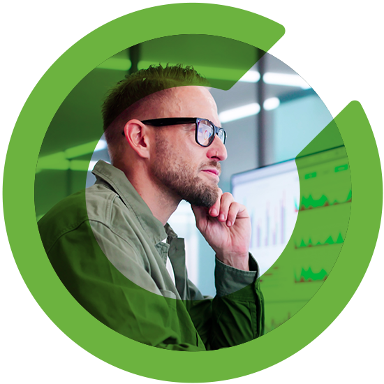 A man looking over a screen, with a green C overlay