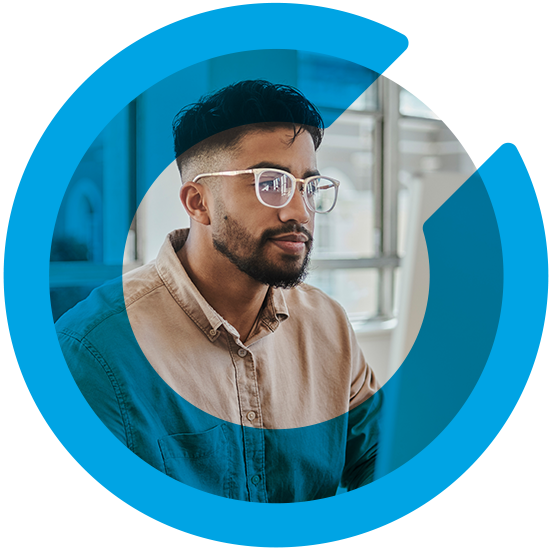 A man in an office, with a blue C overlay