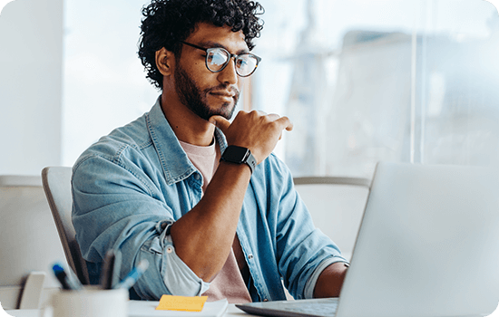 A man working in front of a laptop