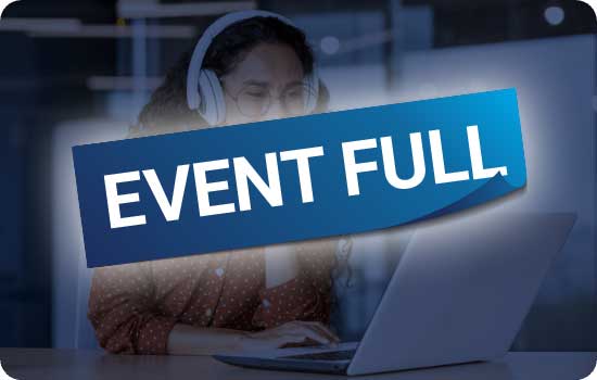 Woman with headphones in front of a laptop