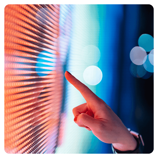 Hand touching a digital screen