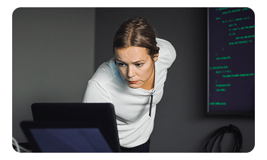 An employee looking at her laptop screen