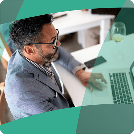 Man typing at a computer, with a green overlay