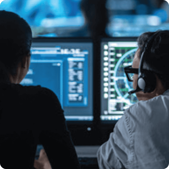 Launching an SOC - two people working in front of computers