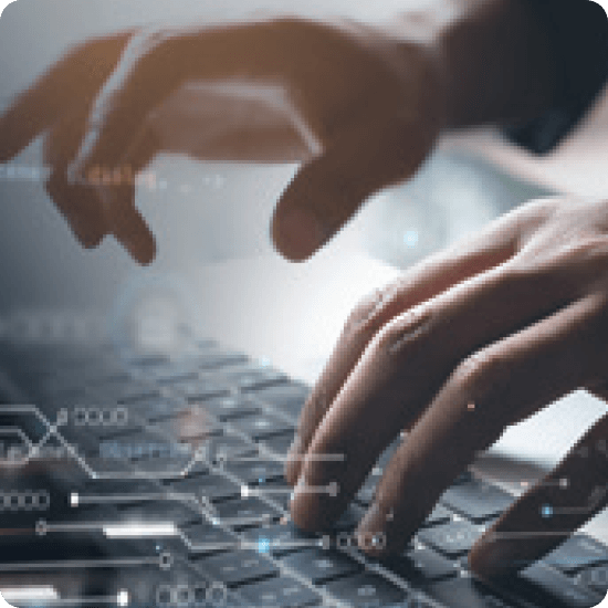 Hands typing on a keyboard