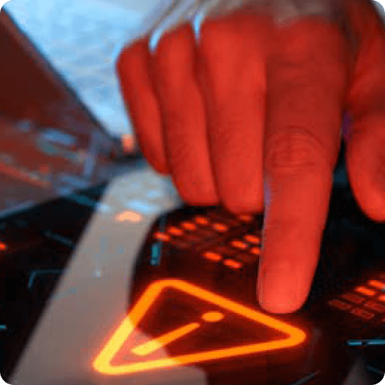 A hand pressing a button on a computer, indicating user interaction with the device.