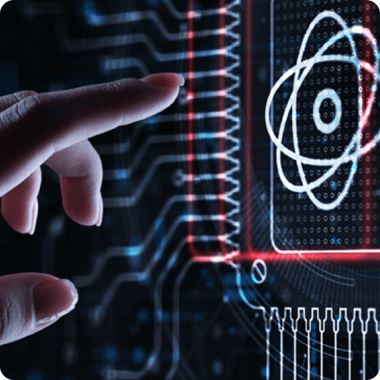 A hand is directing attention to an atom symbol on a computer screen, representing scientific or educational content.