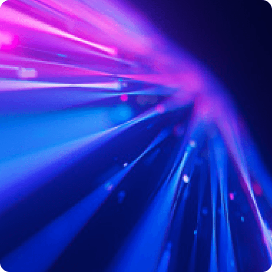 Abstract image of blue and purple light streaks against a dark background