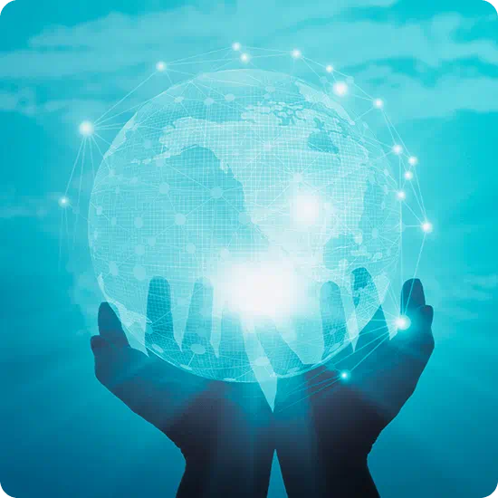 Hands holding a transparent globe with light blue background