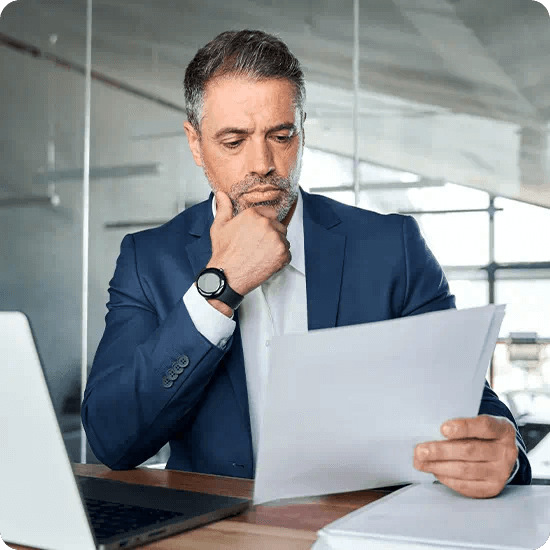 Professional man looking at a whitepaper