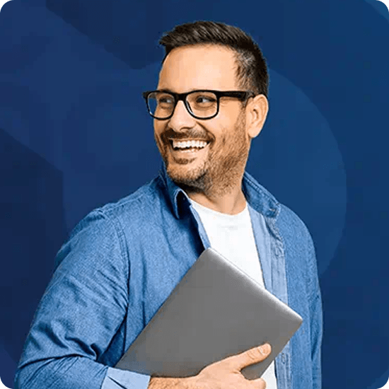 Man holding a laptop on dark blue background