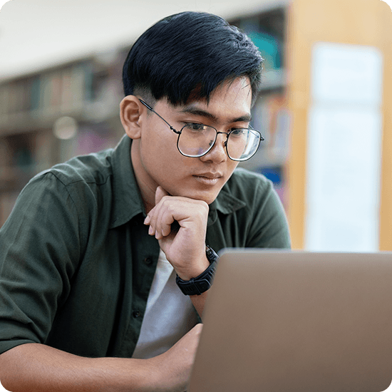Student looking at laptop