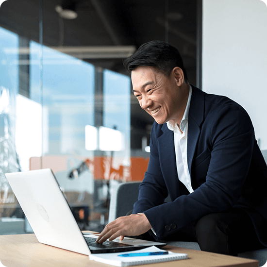 A man looking at his laptop screen