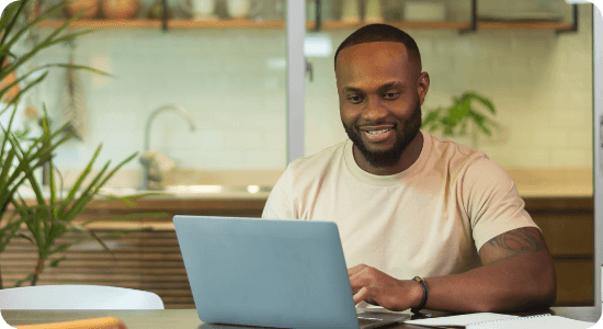 Man working from home in front of a laptop