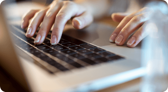 Person typing on a laptop
